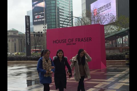 A giant House of Fraser pink bag outside the main entrance
